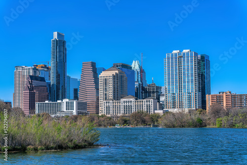 Austin, Texas cityscape and view of Colorado River at the front