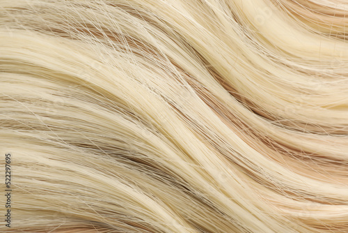 Beautiful blonde hair as background, closeup view