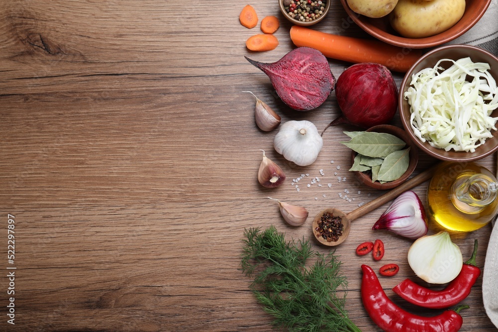 Fresh borscht ingredients on wooden table, flat lay. Space for text Fresh borscht ingredients on wooden table, flat lay. Space for text