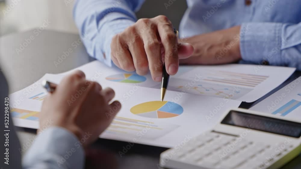 Close up of hands are working and brainstorming on paperworks about business financial and marketing. Close up of hands are working and brainstorming on paperworks about business financial and marketing.