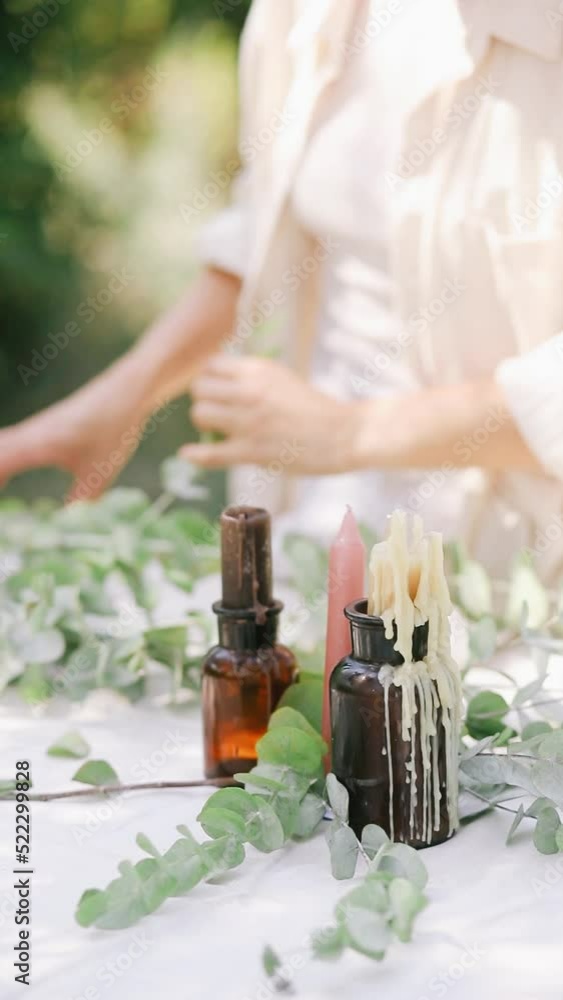 Candles setting of the summer dinner table in the park