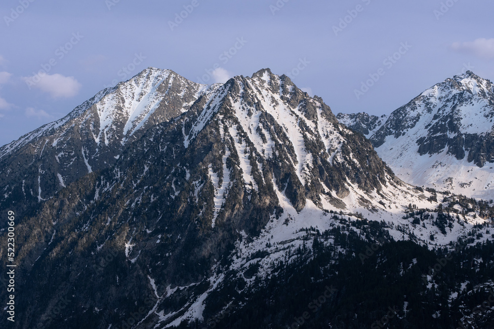 Sunrise in snow covered alps mountains