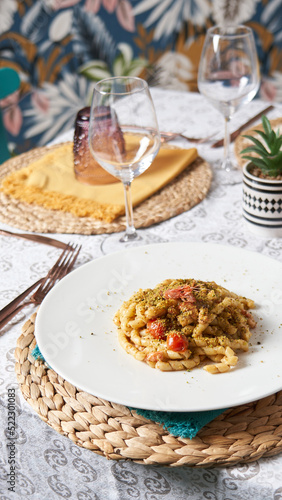 Elegant and Delicious italian pasta dishes served on a white plate in a restaurant. Food concept