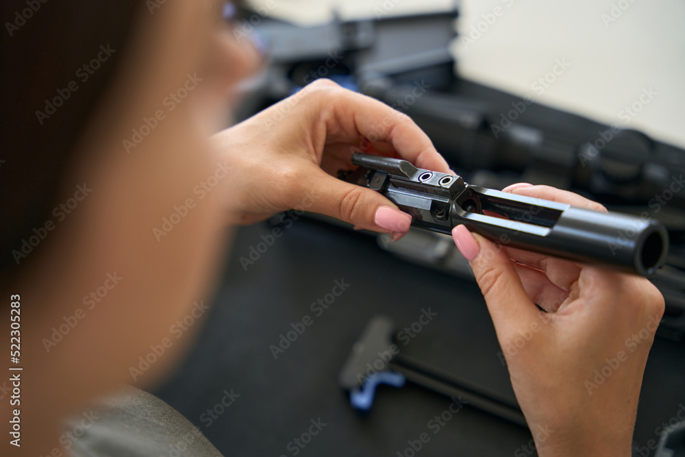 Woman holding a technical detail in her hands Woman holding a technical detail in her hands