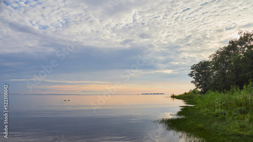 Coast of Gulf of Finland of Baltic Sea: calm, sunset, clouds, idyll, dubki park. © ROMAN BELIAKOV