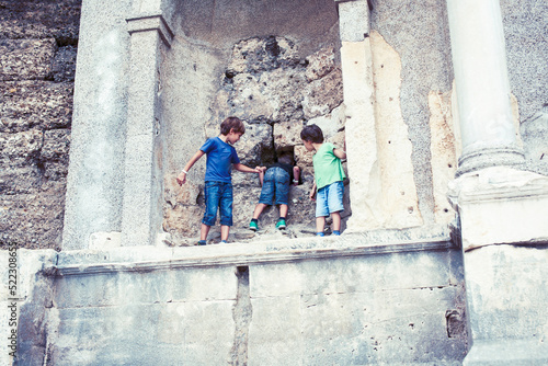 little boy exploring ancient architecture, lifestyle people on summer vacation