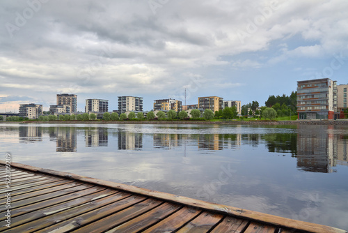 Finnish Joensuu near Pielisjoki river: new neighborhoods, modern architecture, carpet cleaner. photo