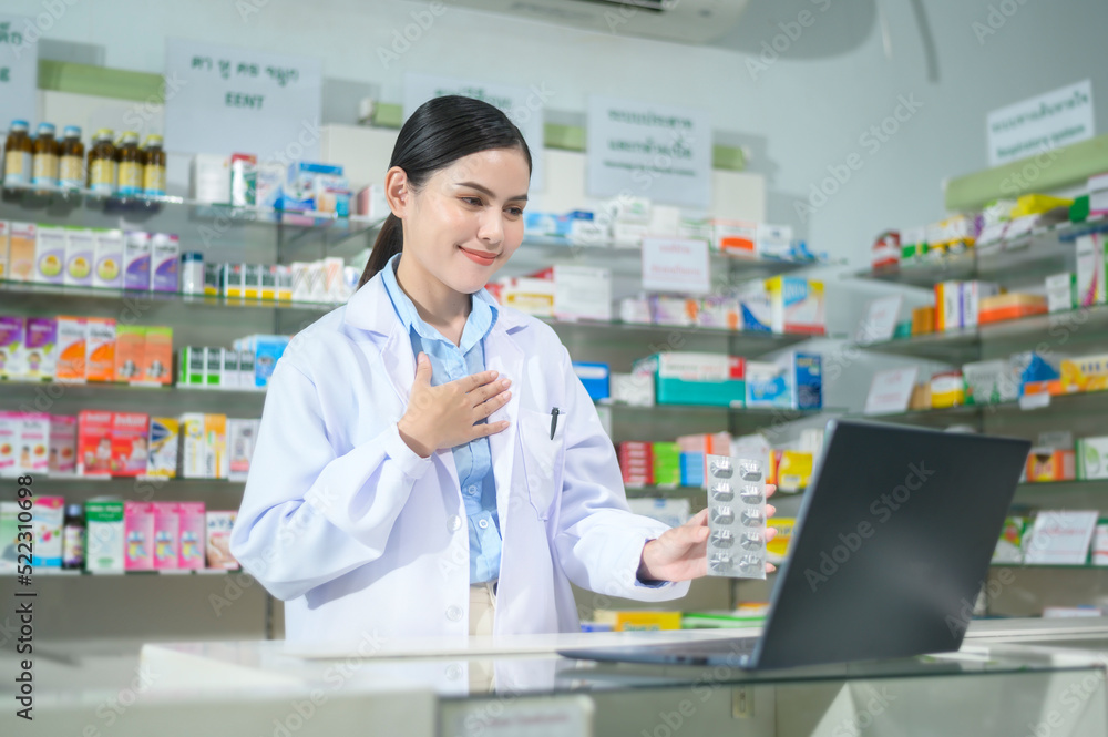 Female pharmacist counseling customer via video call in a modern pharmacy drugstore.