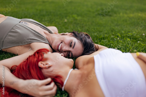 Beautiful lgbt couple enjoying themselfs together, being outdoor. photo