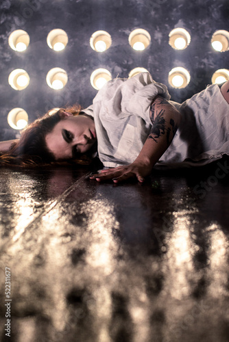 Sexy girl dance on front of spot light wall with smoke