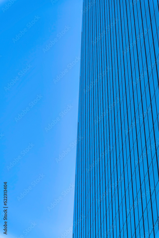Skyscraper building with a reflection of the sky on its glass walls- Austin, Texas Skyscraper building with a reflection of the sky on its glass walls- Austin, Texas