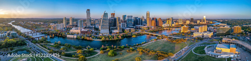 Panoramic cityscape of Austin, Texas near the Colorado River against the sunset skyline