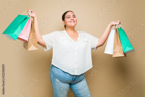 Portrait of an obese woman excited about her shopping at the mall