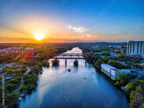 Aerial view of Colorado River during sunset in an urban area at Austin  Texas