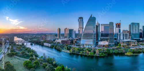Colorado River and the cityscape of Austin, Texas against the sunset sky © Jason