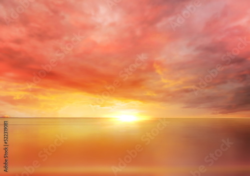  romantic pink sunset at sea  yellow cloudy sky sun light reflection on water waves  summer nature background © Aleksandr