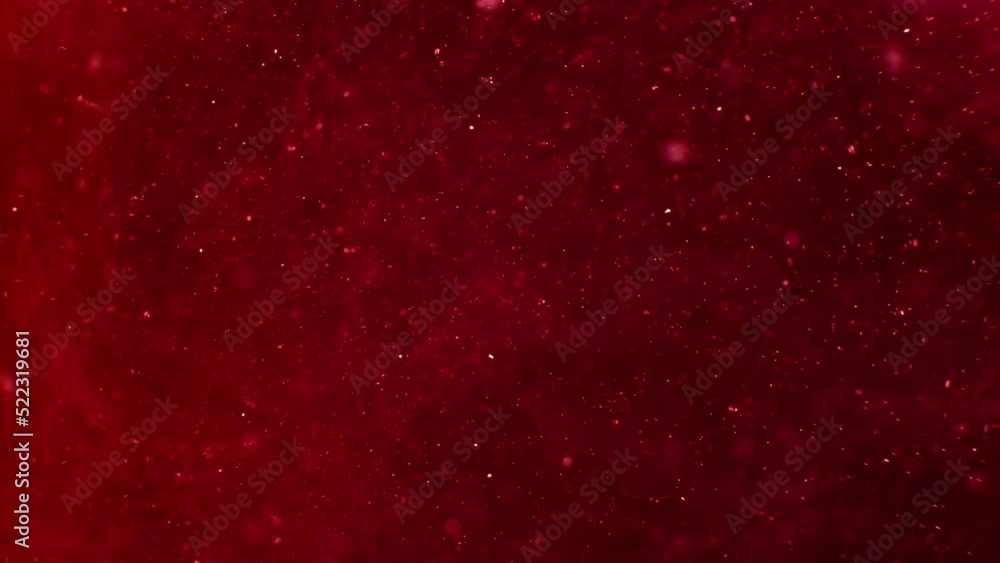 glitter ink spreading in water. Abstract background glitter ink spreading in water. Abstract background