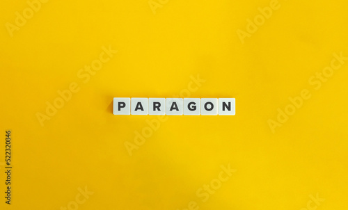 Paragon Word on Letter Tiles on Yellow Background. Minimal Aesthetics.