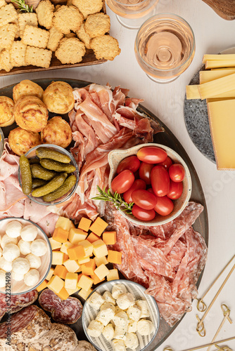 Appetizers table with different antipasti, charcuterie, snacks, cheese. Finger food for buffet party. Traditional french or italian entires. Top view