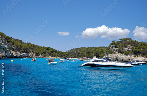 Menorca, Spain: Beautiful bay with sailing boat catamaran