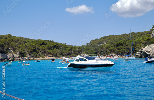 Menorca, Spain: Beautiful bay with sailing boat catamaran © Matteo
