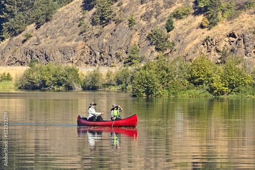 Couple paddling a canoe in Idaho.