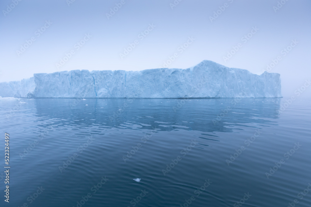 Climate change and global warming. Icebergs from a melting glacier in Ilulissat Glacier, Greenland. The icy landscape of the Arctic nature in the UNESCO world heritage site.