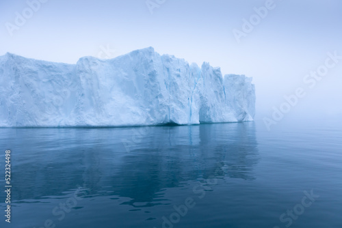 Climate change and global warming. Icebergs from a melting glacier in Ilulissat Glacier, Greenland. The icy landscape of the Arctic nature in the UNESCO world heritage site.