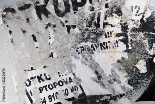 Old torn street poster advertisement background on a metal surface