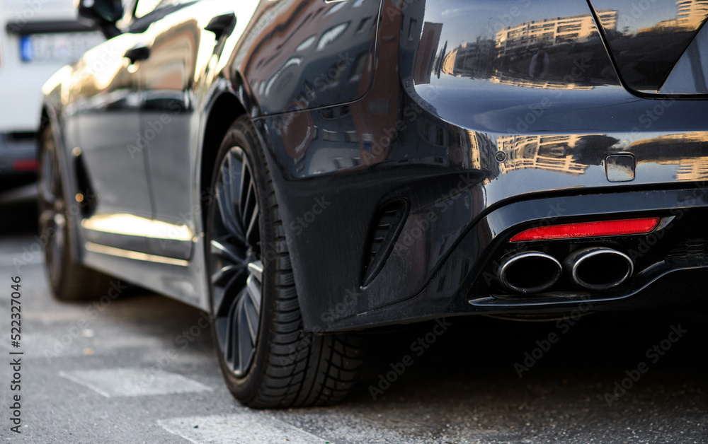 rear part of car end and exhausts of an expensive sports car rear part of car end and exhausts of an expensive sports car