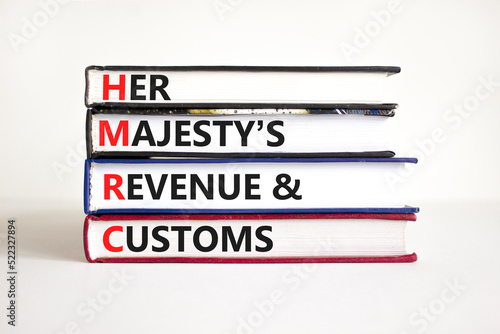 HMRC her majestys revenue and customs symbol. Concept words HMRC her majestys revenue and customs on books on beautiful white background. Business HMRC revenue and customs concept. Copy space. photo