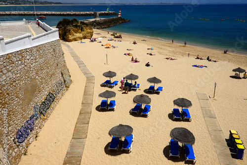 Europe, Atlantic Ocean, Portugal, Algarve region , Faro district , Lagos, panoramic view of coast in city center, Batata beach, above mouth of  Bensafrim river, in far background Meia Praia photo