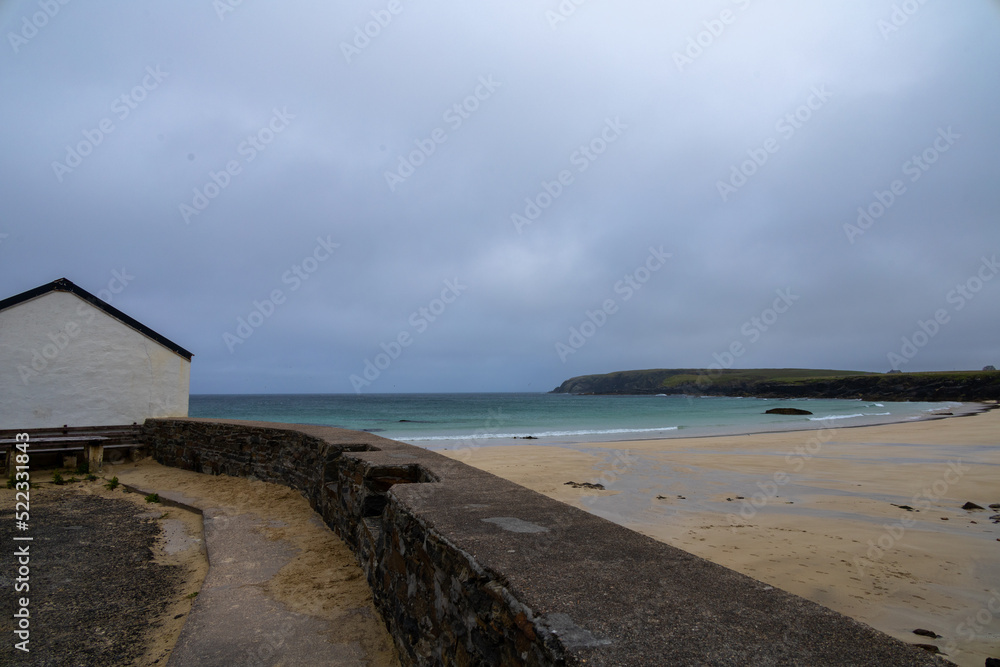 beautiful, lonely wilderness of the Port Ness Beach, Isle of Lewis, Outer Hebrides, in a windy, rainy day with steady drizzle. White sands, paradise beach, Atlantic weather. Scotland.