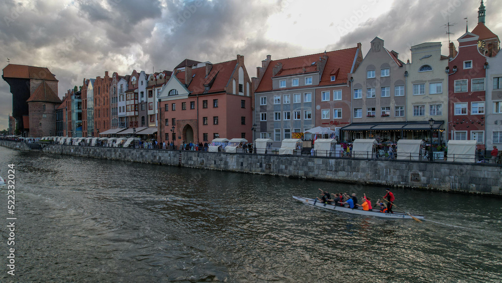 A water channel in the center of Gdansk. Ships and buildings.
