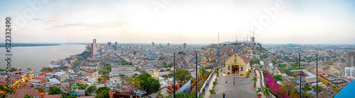Panoramic photo of the view of Guayaquil from the top of the lighthouse on the Cerro Santa Ana  Saint Ana hill   a moment before sunset after a warm sunny summer day. Ecuador.