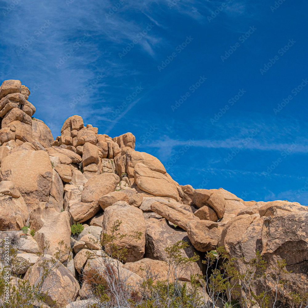 Square Low angle view of a rocky mountain against the clear blue sky in a national park in California Square Low angle view of a rocky mountain against the clear blue sky in a national park in California