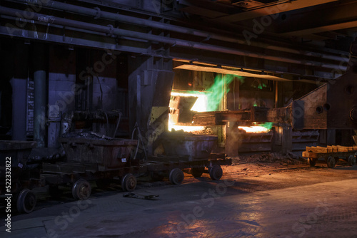 The process of loading copper ore into a gas furnace.