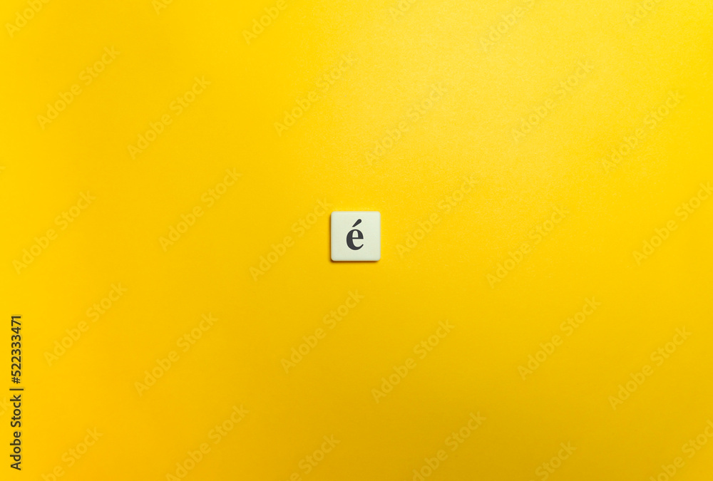 Acute Accent Diacritical Mark on Letter Tile on Yellow Background. Minimal Aesthetics. Acute Accent Diacritical Mark on Letter Tile on Yellow Background. Minimal Aesthetics.