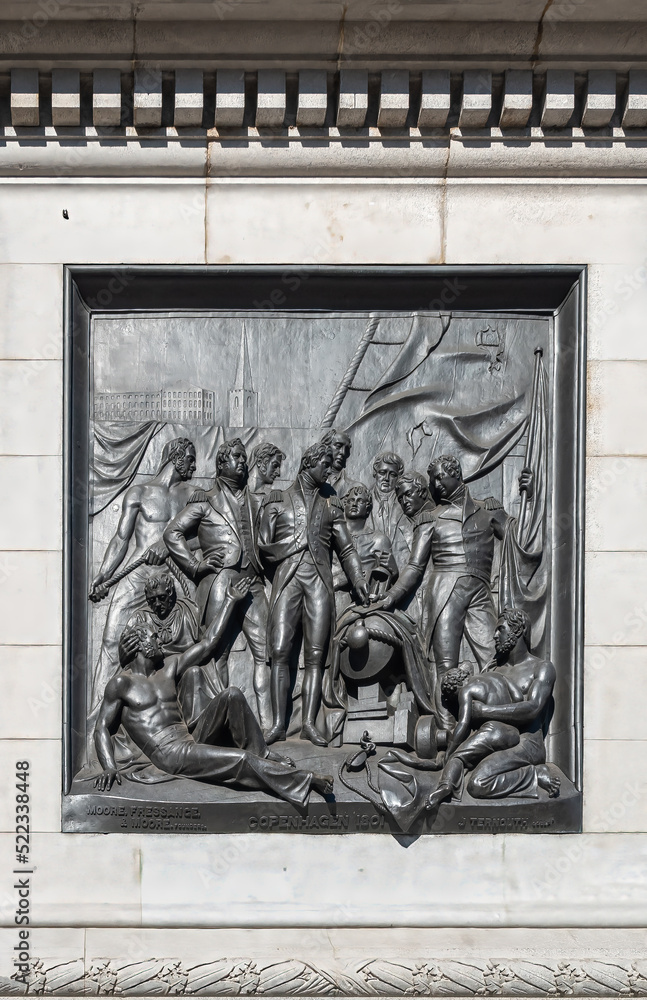 London, UK- July 4, 2022: Trafalgar Square. Closeup of black mural sculpture set in white marble pedestal of Nelson's Column depicts scene of naval battle at Copenhagen in 1801 London, UK- July 4, 2022: Trafalgar Square. Closeup of black mural sculpture set in white marble pedestal of Nelson's Column depicts scene of naval battle at Copenhagen in 1801
