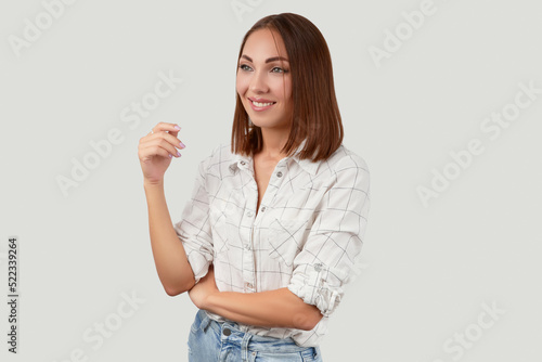 Beautiful woman in casual clothes posing over white background