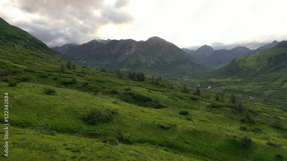 Aerial view of Hatcher Pass, Alaska. Mountain Pass pass through the Talkeetna Mountains from above. Summer Alaskan landscape Aerial view of Hatcher Pass, Alaska. Mountain Pass pass through the Talkeetna Mountains from above. Summer Alaskan landscape