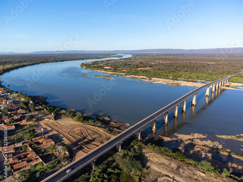 Beautiful bridge over the silver river in the morning sun on the edge of a small town in the interior of northeastern Brazil  Rio S  o Francisco