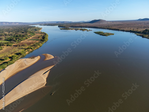 Amazing São Francisco River in a sunny morning in the Brazilian northeast leaving a beautiful and silvery river in the midst of low bush nature