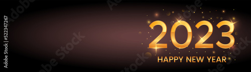 Greeting card or poster with happy new year 2023 with gold glitter and shine.
