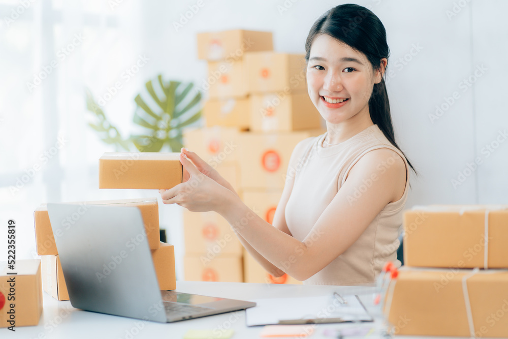 Asian teenager owner business woman work at home for online shopping and sale Asian teenager owner business woman work at home for online shopping and sale