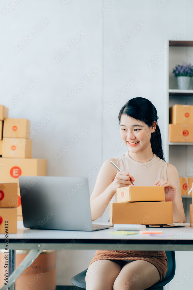 Asian teenager owner business woman work at home for online shopping and sale Asian teenager owner business woman work at home for online shopping and sale