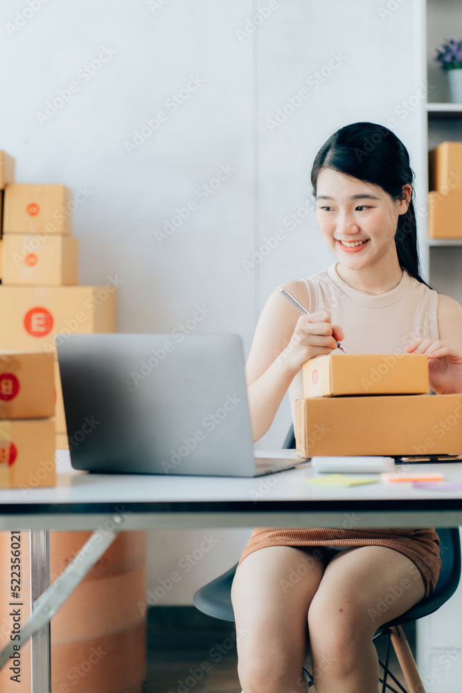Asian teenager owner business woman work at home for online shopping and sale Asian teenager owner business woman work at home for online shopping and sale