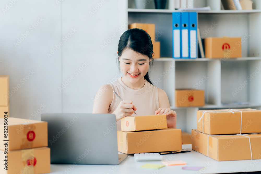 Asian teenager owner business woman work at home for online shopping and sale Asian teenager owner business woman work at home for online shopping and sale