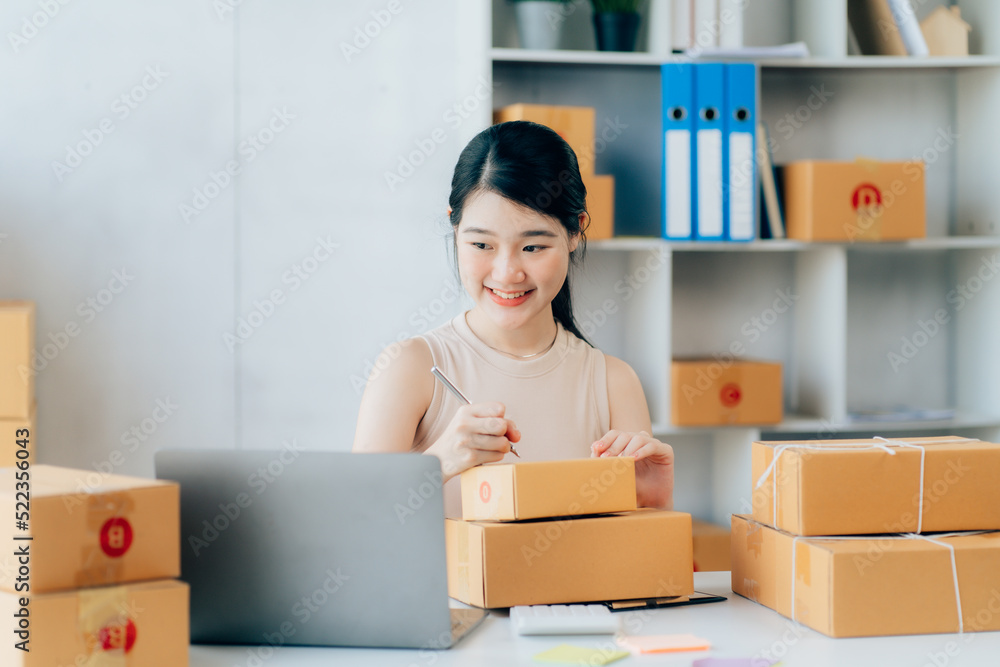Asian teenager owner business woman work at home for online shopping and sale Asian teenager owner business woman work at home for online shopping and sale