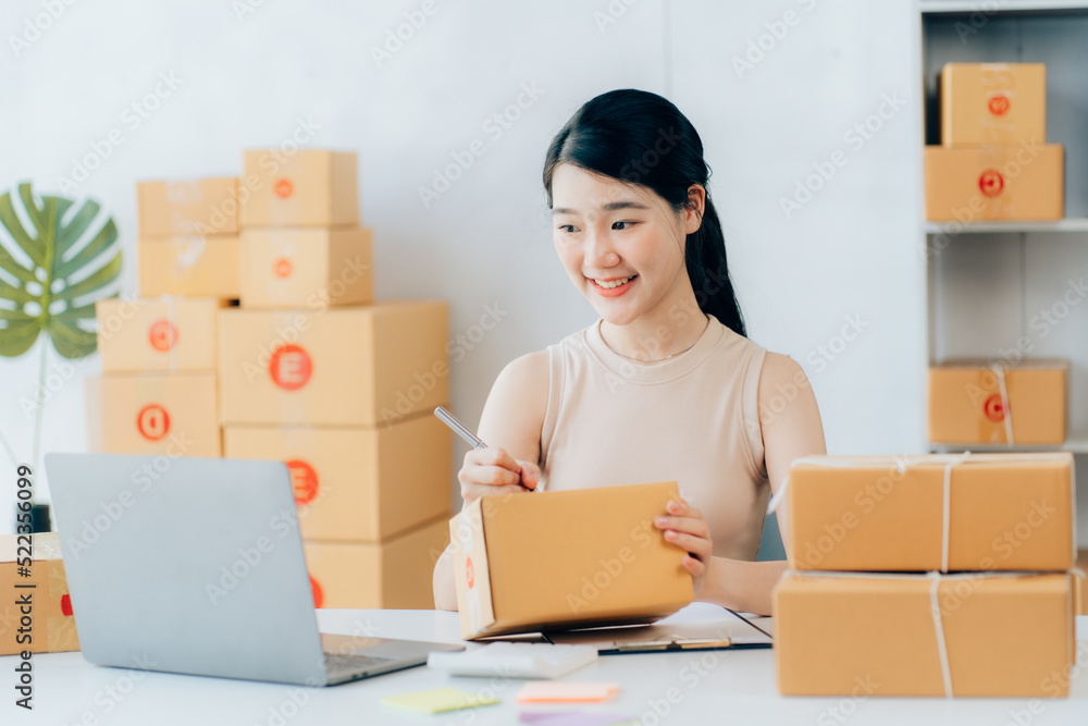 Asian teenager owner business woman work at home for online shopping and sale Asian teenager owner business woman work at home for online shopping and sale